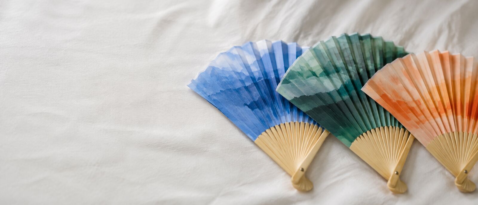 Custom printed fabric hand fans with a logo